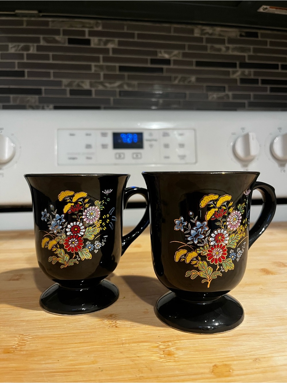 Pair of Vintage 70s Black Floral Pedestal Mugs